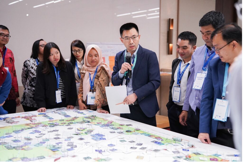 Participants conduct simulation exercises on transboundary marine zoning and multi-sector coordination through the MSP Challenge Board Game.